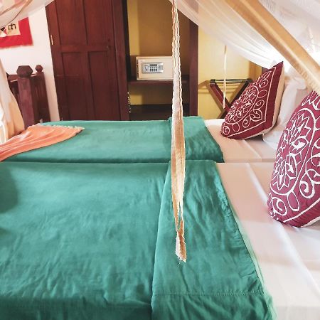 เฟลม ทรี คอตเทจเจส Hotel นูงวี ภายนอก รูปภาพ