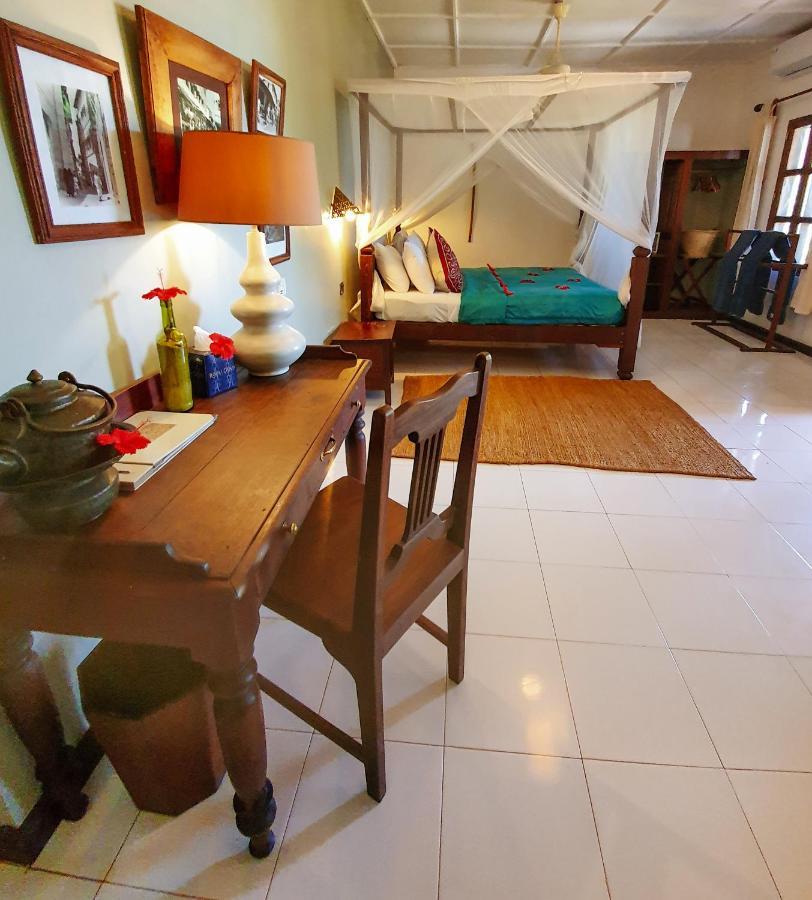 เฟลม ทรี คอตเทจเจส Hotel นูงวี ภายนอก รูปภาพ
