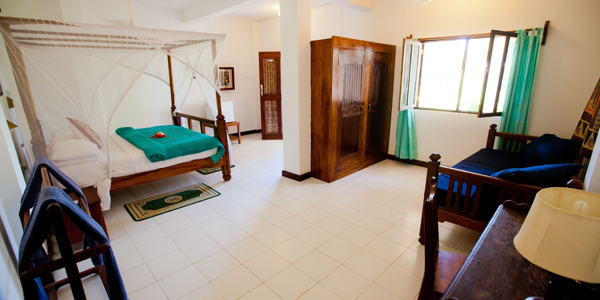 เฟลม ทรี คอตเทจเจส Hotel นูงวี ภายนอก รูปภาพ