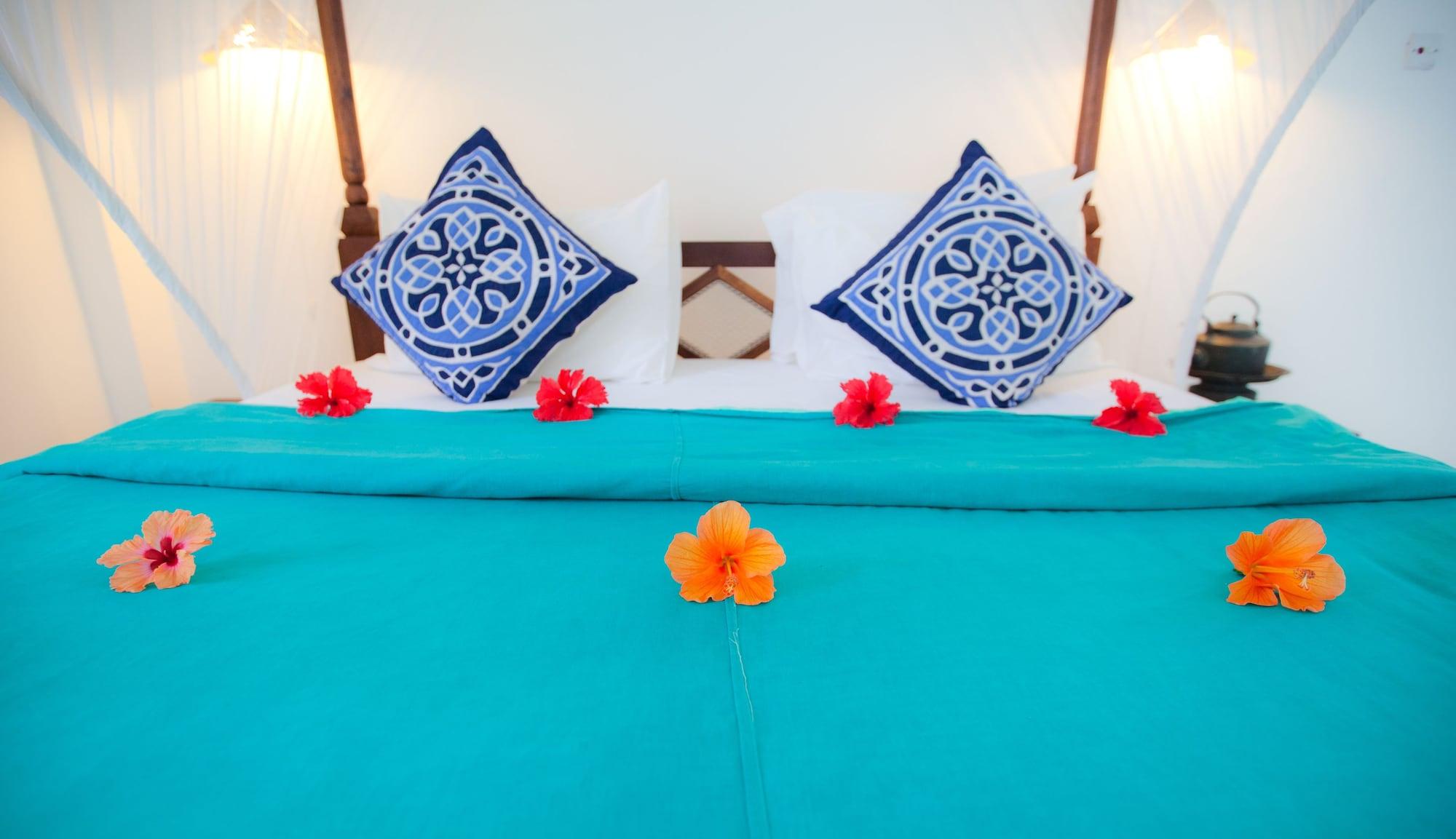 เฟลม ทรี คอตเทจเจส Hotel นูงวี ภายนอก รูปภาพ