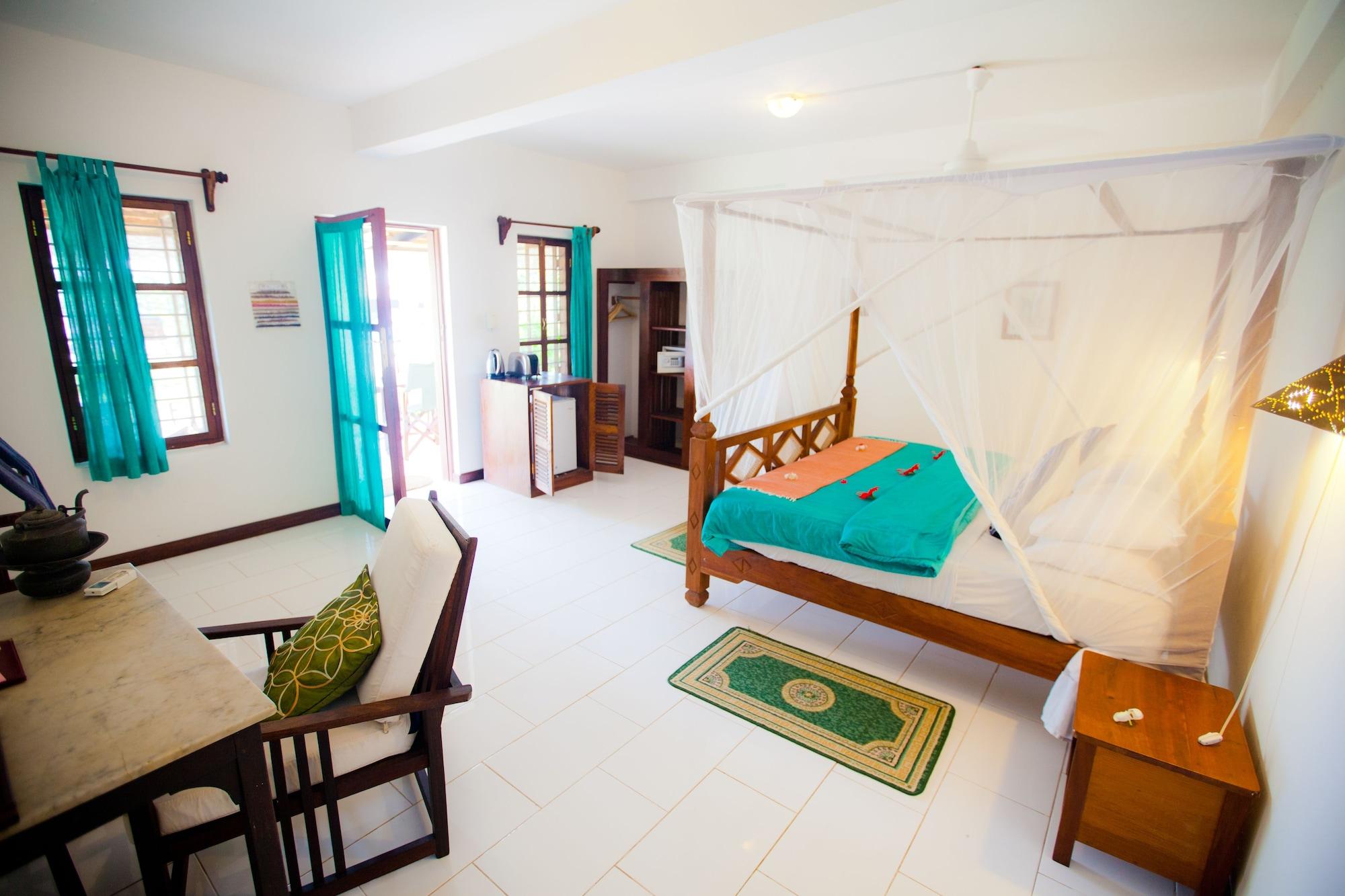 เฟลม ทรี คอตเทจเจส Hotel นูงวี ภายนอก รูปภาพ