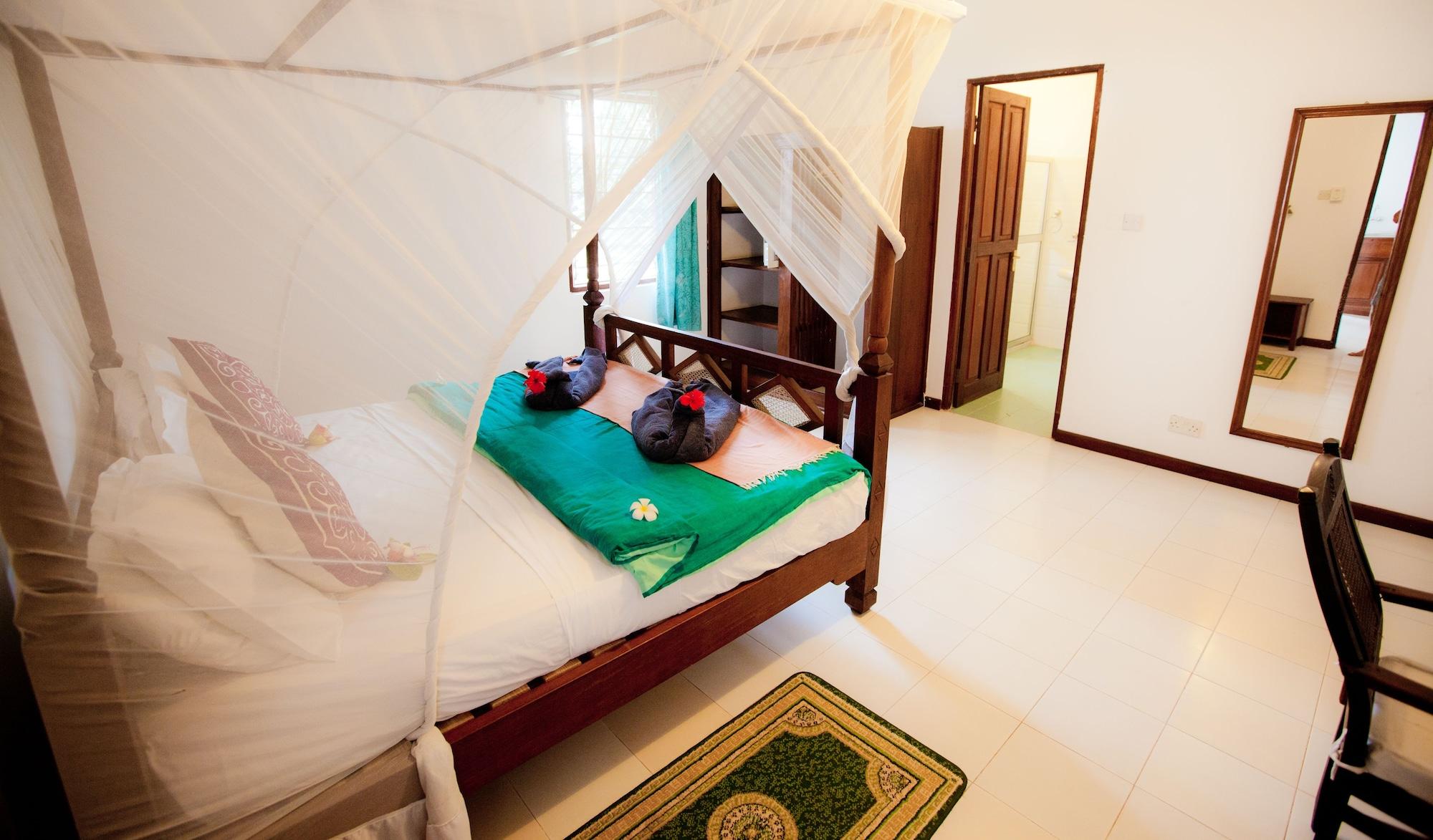 เฟลม ทรี คอตเทจเจส Hotel นูงวี ภายนอก รูปภาพ