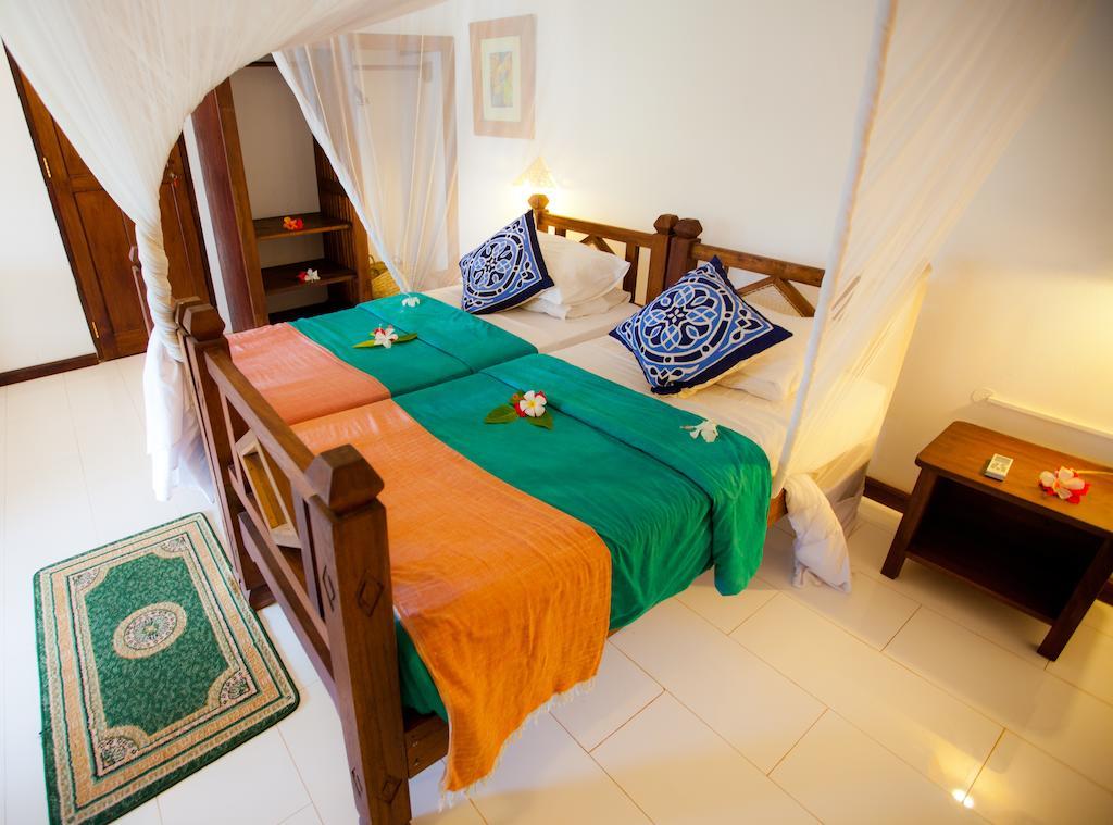 เฟลม ทรี คอตเทจเจส Hotel นูงวี ภายนอก รูปภาพ